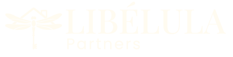Libélula Group | About Libélula Group | Vacation Rentals &Amp; Expert Management Libélula Partners Logo In White With A Dragonfly And Key-Shaped Tail, Representing Property Management Services